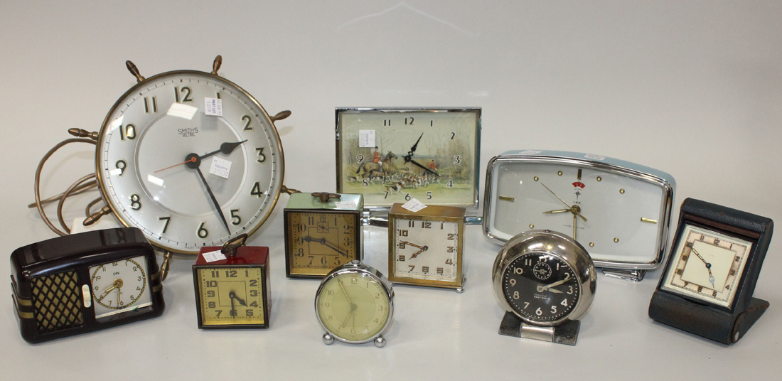 A group of various mantel clocks and bedside alarm clocks, together with a Smiths electric wall