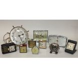 A group of various mantel clocks and bedside alarm clocks, together with a Smiths electric wall
