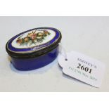 A mid-18th Century South Staffordshire blue enamel oval souvenir snuff box, the hinged lid painted