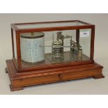 An early 20th Century walnut cased barograph with lacquered brass mechanism and clockwork