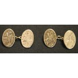 A pair of 9ct gold oval cufflinks, the backs and fronts engraved with birds and foliate sprays,