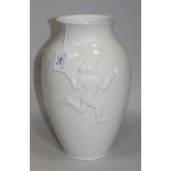 A Royal Copenhagen white glazed porcelain vase, the ovoid body moulded in relief with a dancing boy,