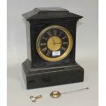 A late 19th Century French slate mantel clock with eight day movement striking hours and half