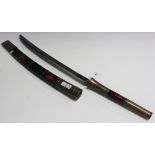 A Burmese brass mounted dha with curved single edged blade, length approx 45cm, black and red