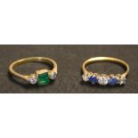 A gold, emerald and diamond set three stone ring, mounted with the rectangular cut emerald between