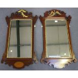 A pair of 20th Century George III style mahogany fretwork framed wall mirrors, with gilded phoenix