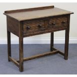 A 20th Century Jacobean Revival oak side table, fitted with two short drawers, on block legs, united