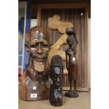 A group of three African carved wood pieces, comprising a portrait bust a bearded man, height approx
