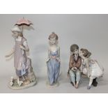 Three Lladro porcelain figures, comprising Susan and the Doves, No. 5156, Ten and Growing, No.