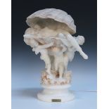 An early 20th Century carved alabaster table lamp, titled 'La Perla', modelled with three winged