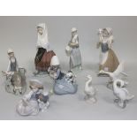 A group of five Lladro porcelain figures, comprising Festival Time, No. 5053, Shepherdess with Dove,