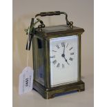 An early 20th Century French brass carriage timepiece with eight day movement, the back plate