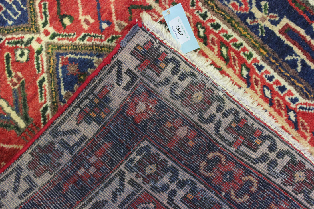 A Sirjan rug, South Persia, mid-20th Century, the red field with three columns of four blue - Image 2 of 2