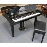 A Samick digital grand piano within a black case, model SE-876G, height approx 86cm, width approx