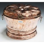 A late 19th Century Dutch copper coal box, the hinged lid embossed with a bold flowerhead (