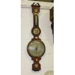 An early 19th Century rosewood wheel barometer with silvered dial, hygrometer, alcohol