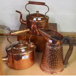 A Victorian copper kettle, a similar smaller kettle, a copper jug and a Victorian walnut jewellery