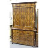 A mid-19th Century Continental flame mahogany secrétaire linen press, the moulded pediment above a