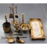 A small group of brassware, including a pair of Victorian ejector candlesticks, various fire tools