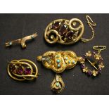 A gold, amethyst and seed pearl set brooch designed as a circular wreath, a Victorian turquoise