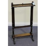 An early Victorian rosewood firescreen, with a pull-up slide and fold-down shelf, on turned supports