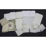 A quantity of whitework, including linen and damask tablecloths, place mats and napkins.