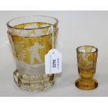 A Bohemian amber flashed engraved glass beaker, late 19th/early 20th Century, of flared, faceted