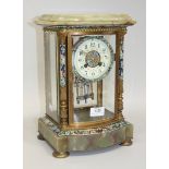 A late 19th Century French brass, onyx and champlevé enamel four glass mantel clock with eight day