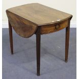 A George III mahogany oval Pembroke table, the moulded top raised on reeded square tapering legs,