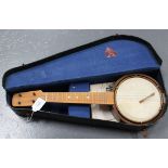An early 20th Century ukulele banjo by Mamelok Bros & Co, cased.