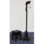 A 20th Century Chinese hardwood lamp standard, carved in the form of a dragon column on a circular