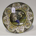 An Italian maiolica circular dish, late 19th/early 20th Century, the central well painted with a