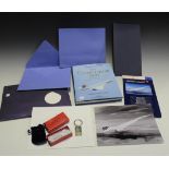 A group of Concorde memorabilia, including a keyring and a book 'The Concorde Story'.
