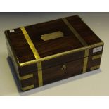 A Regency rosewood and brass bound work box, the hinged lid with a recessed handle, width approx