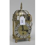 A mid-20th Century brass lantern style mantel timepiece with Empire movement, the 17th Century style