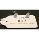 A pair of diamond set single stone earstuds, each mounted with circular cut diamonds, the backs with