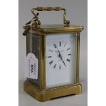 A gilt brass cased carriage clock, the movement striking on a gong, the white enamel dial with Roman