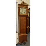 An early 19th Century oak longcase clock with thirty hour movement striking on a bell, the painted