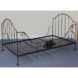 A late 19th Century French wrought iron folding day bed with cast mounts, length approx 185cm.