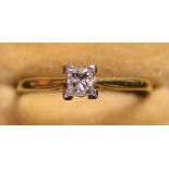 An 18ct gold and diamond single stone ring, claw set with a princess cut diamond.
