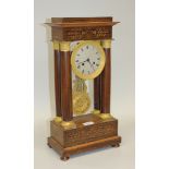 A late 19th Century rosewood and ormolu portico clock with eight day movement striking on a bell via