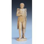 An early 19th Century Dieppe carved ivory figure of Napoleon, possibly modelled after a picture by