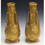 A pair of Art Nouveau style gilt metal vases of naturalistic three handled form, decorated with