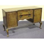 An early 20th Century walnut dining room suite by Waring & Gillow Ltd, comprising a draw-leaf dining