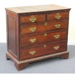 A George III oak chest of drawers, fitted with two short and three long drawers, on bracket feet,