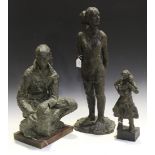 A group of three composition bronze effect sculptures by Catherine Armstrong, including a seated