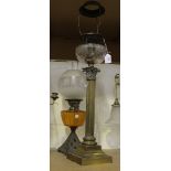A late 19th Century cast brass and cut glass table oil lamp by Hinks & Sons, the circular facet