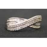 A 9ct white gold and diamond set ring, mounted with two rows of circular cut diamonds and two rows