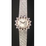 An Omega 18ct white gold and diamond set lady's bracelet wristwatch, the signed circular silvered