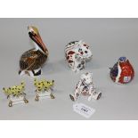 Three Royal Crown Derby Imari pattern bone china paperweights, comprising a brown pelican,